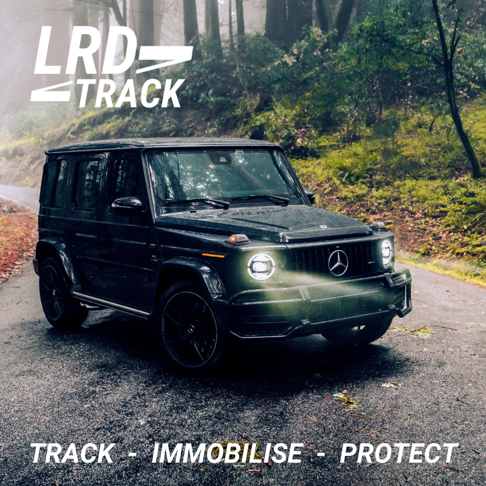 G Wagen (Wagon) on a track in the woods with headlights on